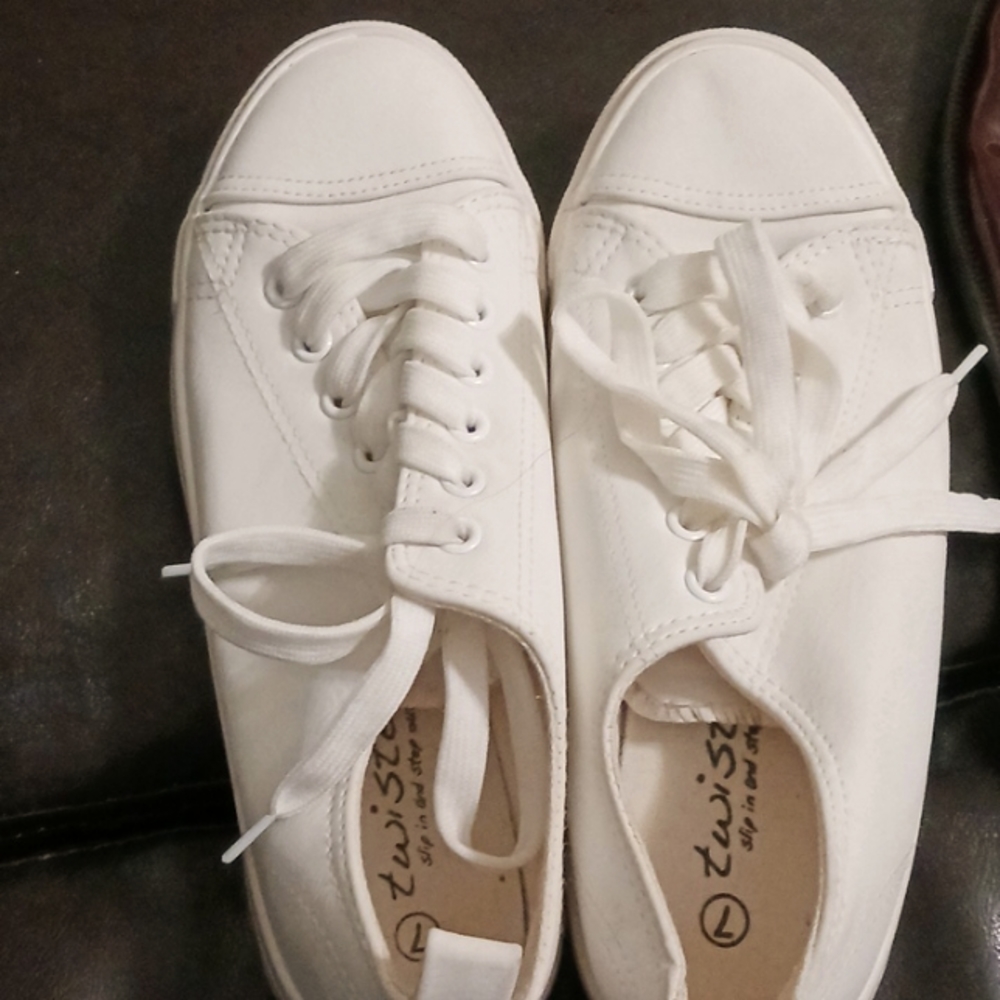 Twisted tennis shoes, a size 7